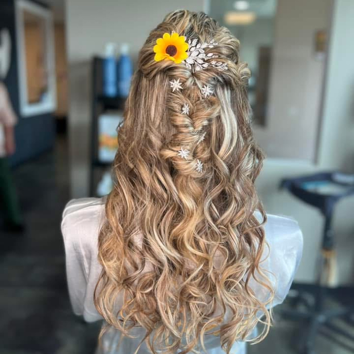 Stylist performing a precision cut at Angel Hair Design in Springville, NY